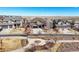 A street view featuring the house and the neighboring homes in the well-planned community at 7680 S Blackstone Pkwy, Aurora, CO 80016