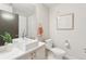 Well-lit bathroom featuring a square sink, modern fixtures, and neutral tones at 1836 Grove St # 108, Denver, CO 80204