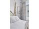Beautiful canopy style bed with neutral decor and soft lighting at 1836 Grove St # 108, Denver, CO 80204