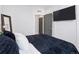 Cozy bedroom with a plush bed, modern decor, and natural light at 1836 Grove St # 108, Denver, CO 80204