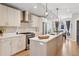 Open concept kitchen with modern cabinetry, stainless steel appliances, and a central island at 1836 Grove St # 108, Denver, CO 80204