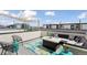 Relaxing rooftop deck with comfortable seating, a stylish rug, and city views at 1836 Grove St # 108, Denver, CO 80204