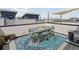 Stylish rooftop deck featuring a dining table, chairs, and city views at 1836 Grove St # 108, Denver, CO 80204