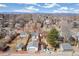 Charming homes with detached garages sit on tree-lined streets with stunning mountain views in the distance at 1850 S Williams St, Denver, CO 80210
