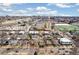 Urban neighborhood with a mix of residential homes and commercial buildings, close to amenities and transportation, with city skyline views at 1850 S Williams St, Denver, CO 80210