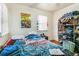 Bedroom featuring a window, closet, and a 'Super Mario Kart' poster at 1850 S Williams St, Denver, CO 80210