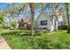 Charming single-story home featuring a well-manicured lawn and cozy front porch at 1850 S Williams St, Denver, CO 80210