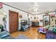 Relaxing living room with hardwood floors, ceiling fan, and easy access to the kitchen at 1850 S Williams St, Denver, CO 80210