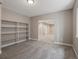 Finished basement space showing neutral walls, carpeted floor and access to additional basement areas at 6900 W Grant Ranch Blvd # 49, Littleton, CO 80123