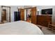 Cozy bedroom with classic wood furniture, rocking chair, and warm, neutral tones at 6900 W Grant Ranch Blvd # 49, Littleton, CO 80123