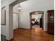 Inviting foyer boasting gleaming hardwood floors and an open view to the bedroom at 6900 W Grant Ranch Blvd # 49, Littleton, CO 80123