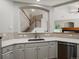 Bright kitchen area featuring white cabinets, stainless steel appliances, and quartz countertops at 6900 W Grant Ranch Blvd # 49, Littleton, CO 80123