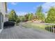 Back deck with gray composite decking overlooking a landscaped backyard at 10155 Charissglen Ln, Littleton, CO 80126