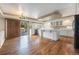 Bright kitchen with center island, stainless appliances, and adjacent dining area at 10155 Charissglen Ln, Littleton, CO 80126