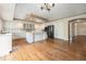 Bright eat-in kitchen with a center island and stainless steel appliances at 10155 Charissglen Ln, Littleton, CO 80126