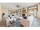 Bright living room with a fireplace, stylish furniture, and hardwood floors at 10155 Charissglen Ln, Littleton, CO 80126