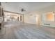 Expansive living area with fireplace, wood-look flooring, and open layout at 10155 Charissglen Ln, Littleton, CO 80126