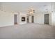 Bright and airy main bedroom with plush carpeting, fireplace, and neutral wall color at 10155 Charissglen Ln, Littleton, CO 80126