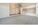 Spacious open-concept area featuring neutral carpeting, with views of the lower level at 10155 Charissglen Ln, Littleton, CO 80126