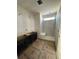 Modern bathroom featuring a walk-in shower, sleek cabinetry, and contemporary fixtures at 22 Waterford St, Erie, CO 80516
