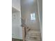 Modern staircase with carpet steps and a large window that allows for natural light at 22 Waterford St, Erie, CO 80516