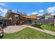 Charming backyard with patio, seating, and a well-maintained lawn at 1840 S Grant St, Denver, CO 80210
