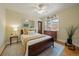 Bright bedroom with a wood-framed bed, hardwood floors, decorative rug, and a vintage dresser at 1840 S Grant St, Denver, CO 80210