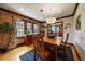 Elegant dining room with hardwood floors, a stylish light fixture, and ample natural light, perfect for meals at 1840 S Grant St, Denver, CO 80210