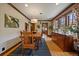 Elegant dining room featuring hardwood floors, natural light, and a rustic table, perfect for Gathering gatherings at 1840 S Grant St, Denver, CO 80210
