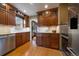 Spacious kitchen with wood cabinets, stainless steel appliances, granite counters, and tile backsplash at 1840 S Grant St, Denver, CO 80210