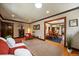 Spacious living room with hardwood floors, stylish furnishings, and seamless flow to the dining area, perfect for entertaining at 1840 S Grant St, Denver, CO 80210
