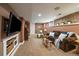 Inviting living room featuring exposed brick, plush seating, and modern entertainment center with mounted TV at 1840 S Grant St, Denver, CO 80210