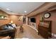 Inviting living room featuring exposed brick, plush seating, and modern entertainment center with mounted TV at 1840 S Grant St, Denver, CO 80210
