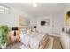 Light-filled basement bedroom featuring a comfy bed and modern decor at 3558 Pecos St, Denver, CO 80211