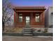 Brick home with front porch and steps at 3558 Pecos St, Denver, CO 80211