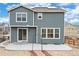 View of backyard with patio and desert landscaping, featuring solar panels on the roof at 12777 Clearview St, Firestone, CO 80504