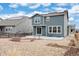 Spacious backyard featuring a patio, fire pit, and low-maintenance landscaping at 12777 Clearview St, Firestone, CO 80504