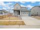 Charming two-story home with a two car garage and inviting front porch at 12777 Clearview St, Firestone, CO 80504
