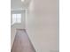 Bright hallway with neutral carpet and natural light from the window at 12777 Clearview St, Firestone, CO 80504