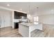 Bright kitchen boasts a large island, stainless steel appliances, pendant lighting, and an open floor plan at 12777 Clearview St, Firestone, CO 80504