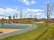 Neighborhood playground with swing sets, a slide, and walking paths at 12777 Clearview St, Firestone, CO 80504