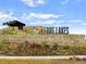 Community entrance sign landscaped with native plants and stone accents at 12777 Clearview St, Firestone, CO 80504