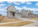 Serene neighborhood street view with well-maintained homes, landscaping, and clear blue skies at 12777 Clearview St, Firestone, CO 80504