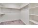 Spacious walk-in closet featuring ample shelving and hanging storage at 12777 Clearview St, Firestone, CO 80504