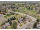 Aerial view of home nestled in a lush neighborhood with mature trees, parks, and walking trails at 7888 S Magnolia Way, Centennial, CO 80112