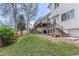 Backyard view of multi-level deck, patio, and grassy yard, ideal for outdoor enjoyment at 7888 S Magnolia Way, Centennial, CO 80112