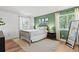 Inviting bedroom with natural light, a cozy bed, and a soothing color palette at 7888 S Magnolia Way, Centennial, CO 80112