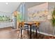 Bright dining area with large windows, modern decor, and hardwood floors offers a delightful eating space at 7888 S Magnolia Way, Centennial, CO 80112