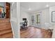 Bright basement office with walkout double doors, desk, and natural light at 7888 S Magnolia Way, Centennial, CO 80112