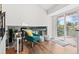 Upstairs sitting area with a comfy chair and ottoman looking out to a private balcony with great views at 7888 S Magnolia Way, Centennial, CO 80112